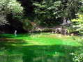 The source of the River Durzon, the sunlight makes the clear water look bright green - Castel de Cantobre G&icirc;tes, Aveyron, France